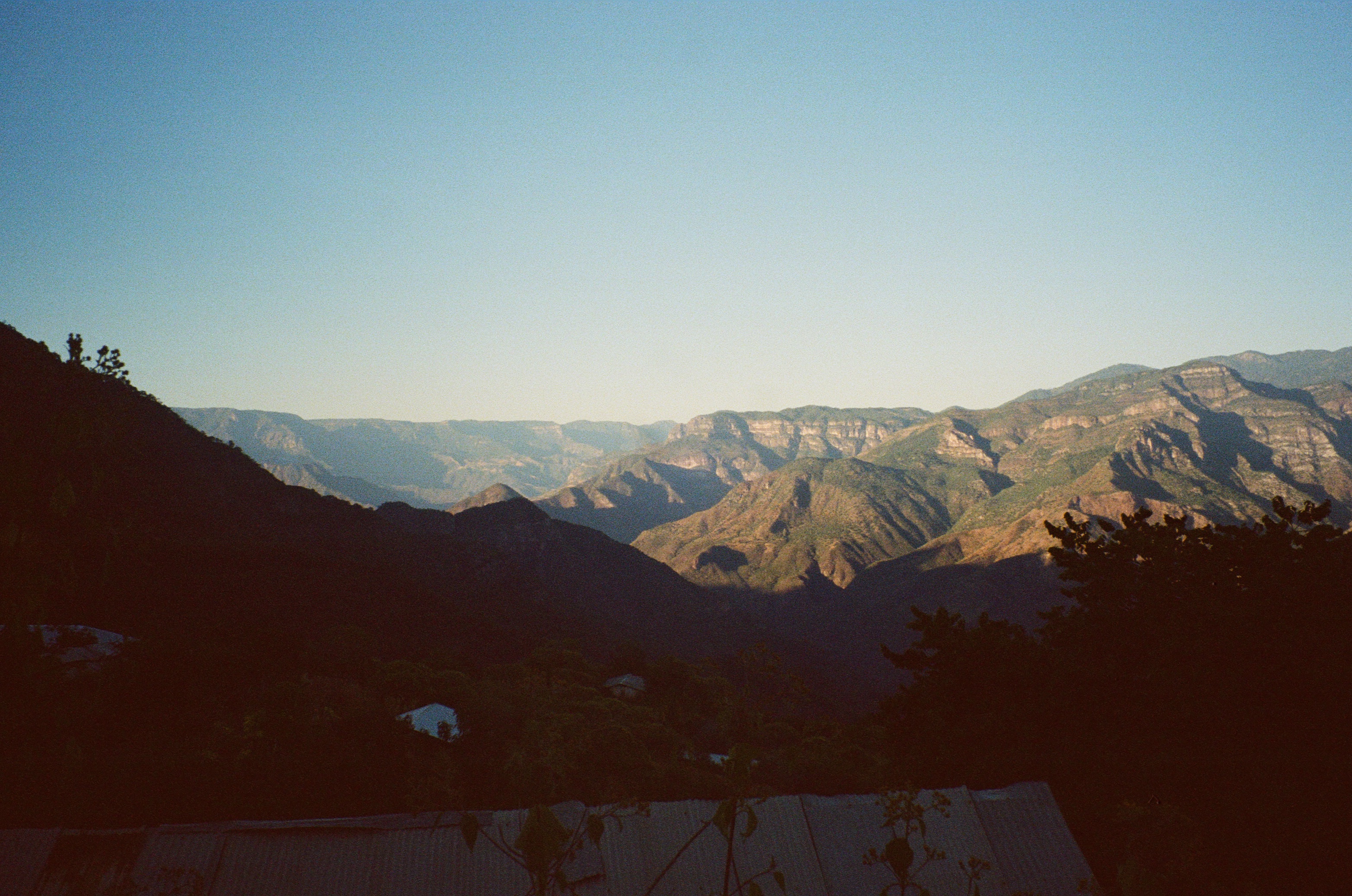 a landscape image of mountains in the background